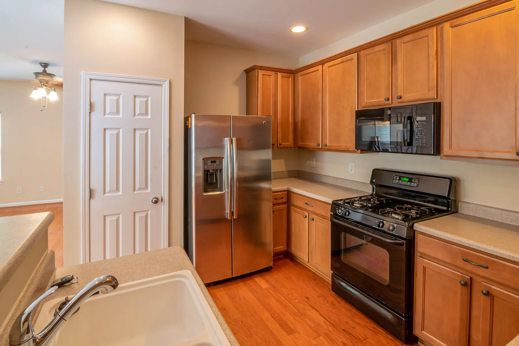 Modern kitchen with refrigerator and microwave appliances