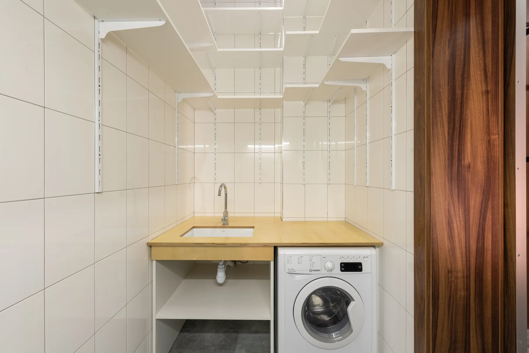 Front-load washing machine in a home laundry space